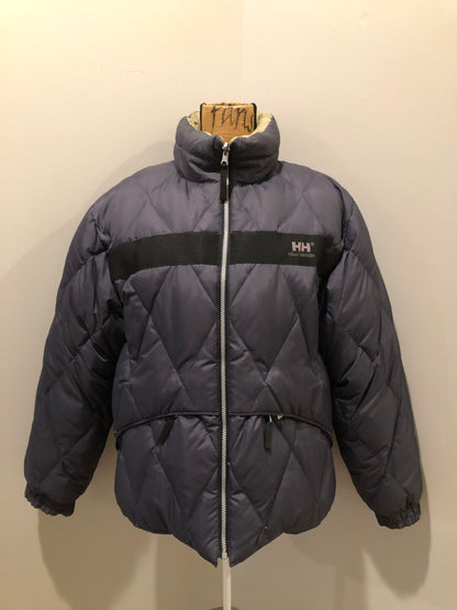 Kingspier Vintage - Helly Hansen reversible charcoal and beige down-filled puffer jacket. This jacket is quilted with zipper closure and zip pockets on both sides. Size Large.