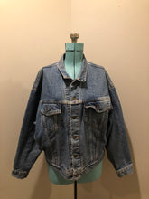 Load image into Gallery viewer, Vintage 1980’s Levi’s medium wash denim trucker jacket with button closures, two flap pockets on the chest, two side pockets and two inside pockets.  Red Tab, 100% cotton, size large -Kingspier Vintage
