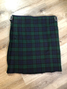 Kingspier Vintage - Black Watch tartan kilt with leather straps on each side to adjust size and fringed top skirt. Kilt is partially lined. Fibres unknown.