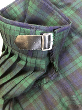 Load image into Gallery viewer, Kingspier Vintage - Black Watch tartan kilt with leather straps on each side to adjust size and fringed top skirt. Kilt is partially lined. Fibres unknown.
