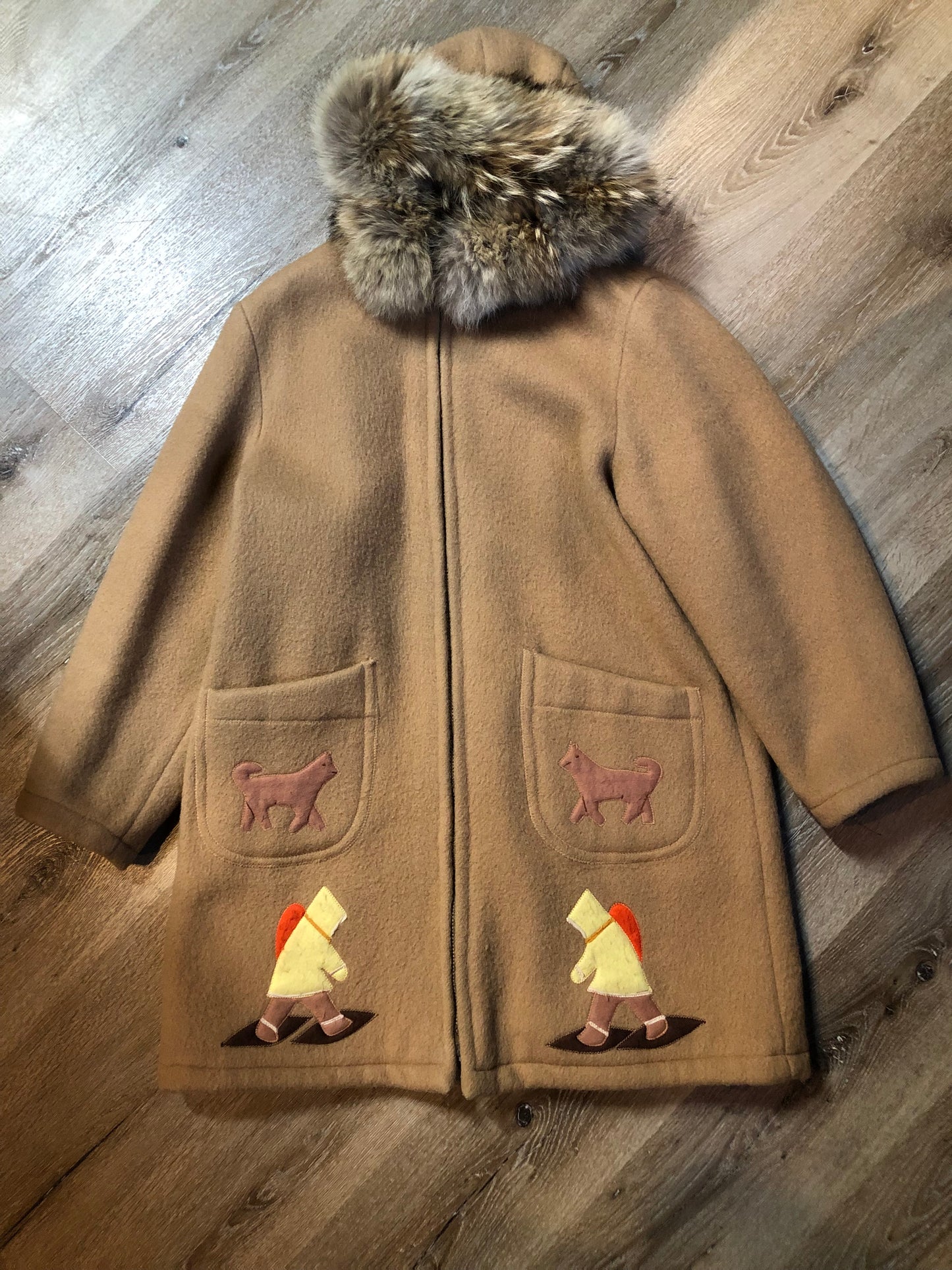 Vintage Inuvik Sewing Company brown 100% pure wool parka.  This parka features a cotton/ polyester blend storm shell with embroidered details, a fur trimmed hood, zipper closure, patch pockets, satin lining and a snowshoeing design in felt applique. Made in northern Canada - Kingspier Vintage