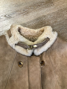 Kingspier Vintage - Karl Inderbieten shearling coat with light brown suede on the outside and soft fur on the inside. This coat is double breasted with button closures, shearling trim and a unique choker detail with brass clasp at the collar. Size medium/ large