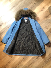 Load image into Gallery viewer, Vintage James Bay 100% pure wool northern parka in sky blue.  This parka features a fur trimmed hood, zipper closure, patch pockets, quilted lining, storm cuffs, leather trim, embroidery details and a northern life design in felt applique. Made in Canada. Size 12 - Kingspier Vintage
