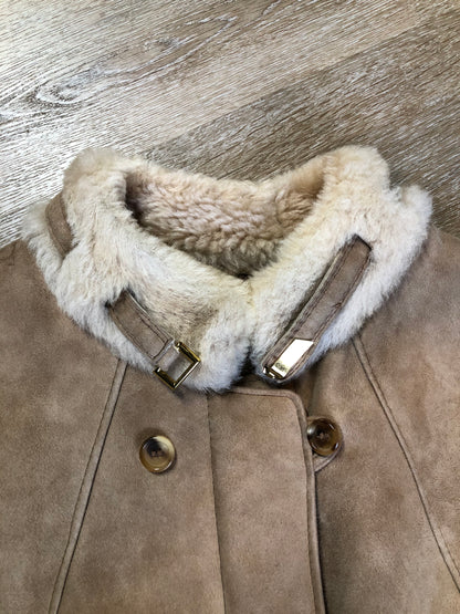 Kingspier Vintage - Karl Inderbieten shearling coat with light brown suede on the outside and soft fur on the inside. This coat is double breasted with button closures, shearling trim and a unique choker detail with brass clasp at the collar. Size medium/ large