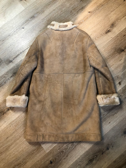 Kingspier Vintage - Karl Inderbieten shearling coat with light brown suede on the outside and soft fur on the inside. This coat is double breasted with button closures, shearling trim and a unique choker detail with brass clasp at the collar. Size medium/ large