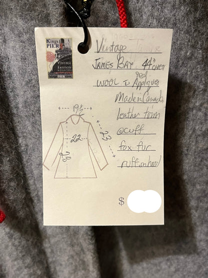 Vintage James Bay100% wool grey northern parka with fox fur trimmed hood, zipper closure, zip front pockets, leather trimmed cuffs, drawstring at waist, quilted lining and felt applique in a seal motif.

Made in Canada
Chest 44”