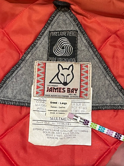 Vintage James Bay100% wool grey northern parka with fox fur trimmed hood, zipper closure, zip front pockets, leather trimmed cuffs, drawstring at waist, quilted lining and felt applique in a seal motif.

Made in Canada
Chest 44”