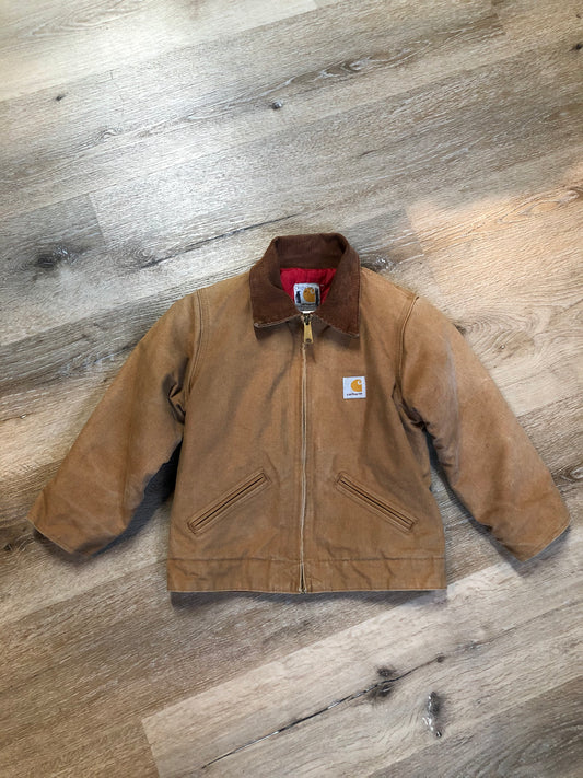 Kingspier Vintage - Kids Carhartt Chore Jacket in Tan Brown with Brown corduroy collar, zipper closure, slash pockets, knit inner cuffs and red quilted lining. Made in the USA. Size childrens 6.