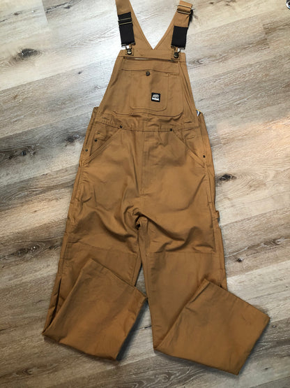 Kingspier Vintage - Berns sleeveless duck canvas overalls in tan brown. Overalls feature adjustable shoulder straps with buckle fastening, hammer loop, patch pocket on the chest, side utility pockets, pockets in the front and back, overalls button at the waist and have reinforced knees. Size 32X32.