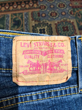 Load image into Gallery viewer, Vintage Levi’s Low Slouch Boot Cut Denim Jeans  Red tab  Low rise  Button fly  Boot cut leg.  93% Cotton/ 5% Polyester/ 2% Lycra  Medium wash  Made in Mexico - Kingspier Vintage
