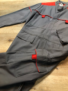 Kingspier Vintage - Vendrig navy coveralls with red piping details, snap closures, ample flap pockets in front and back with side utility pockets. Size medium/ large.