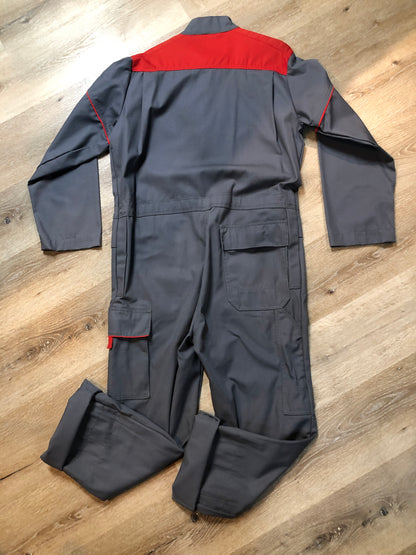 Kingspier Vintage - Vendrig navy coveralls with red piping details, snap closures, ample flap pockets in front and back with side utility pockets. Size medium/ large.