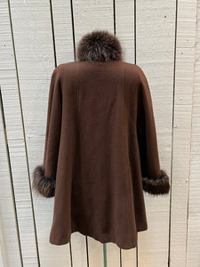 Vintage Rontex International for Eaton brown 100% wool swing coat with raccoon fur trim, button closures and two front pockets.

Made in Canada
Chest 50”
