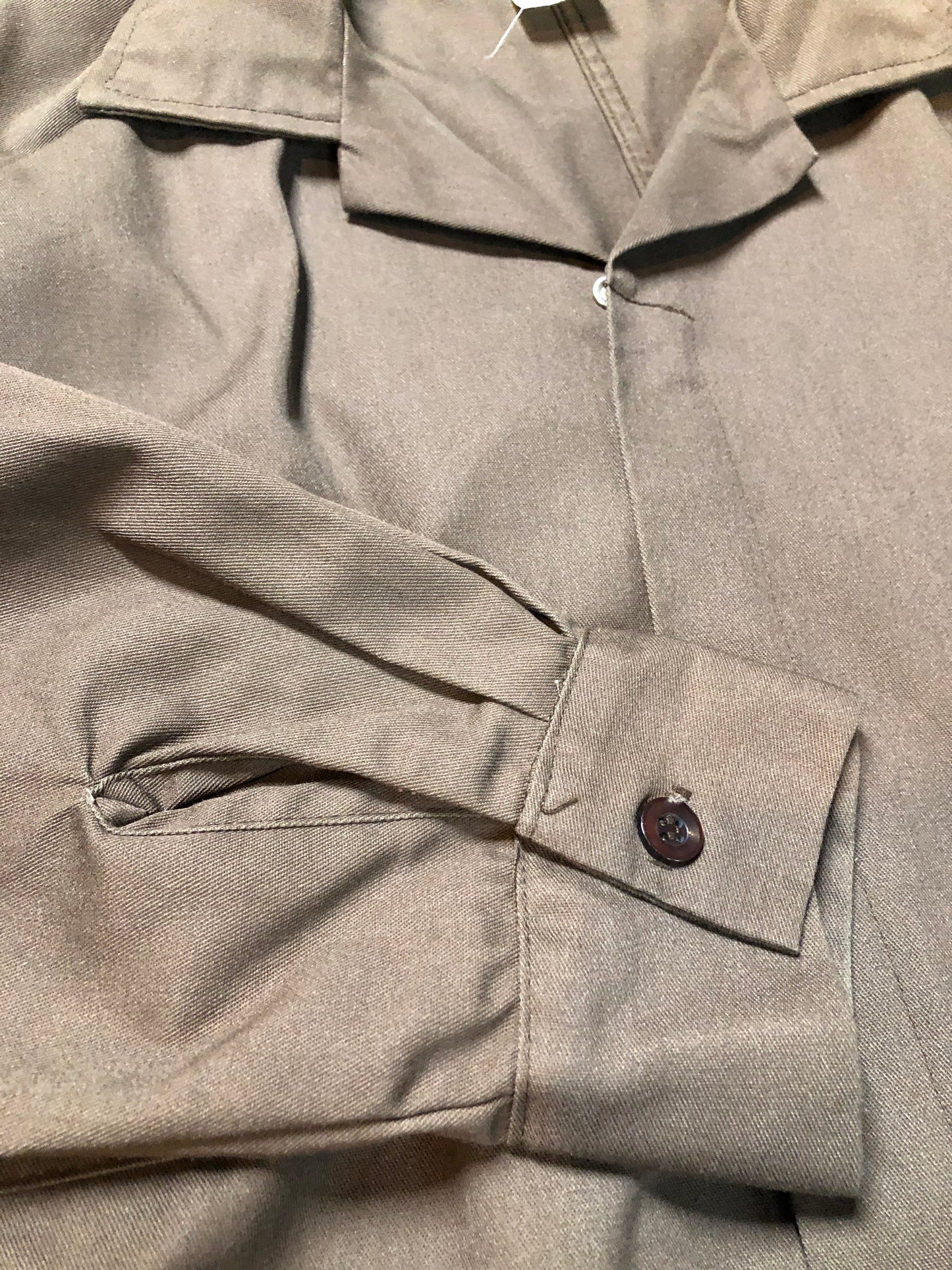 Kingspier Vintage - Parasuit brown wrinkle resistant polyester/ cotton blend coveralls with adjustable belt, snap closures, elastic at the back of the waist, two patch pockets on the chest, front and back. Made in Mexico. Size 46 Regular.