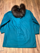 Load image into Gallery viewer, Vintage teal northern parka with fur trimmed hood, fur pom poms, zipper closure, patch pockets in the front and hand embroidered details.

Chest 46”
