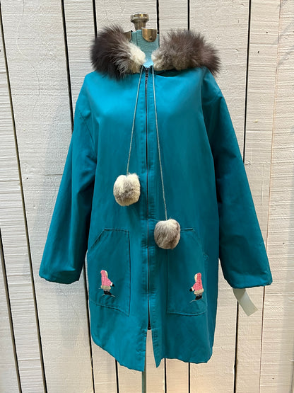 Vintage teal northern parka with fur trimmed hood, fur pom poms, zipper closure, patch pockets in the front and hand embroidered details.

Chest 46”