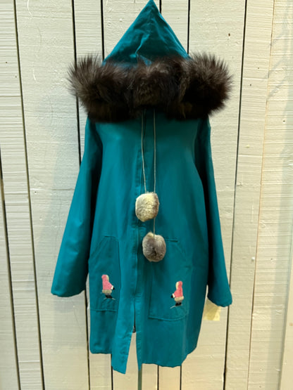 Vintage teal northern parka with fur trimmed hood, fur pom poms, zipper closure, patch pockets in the front and hand embroidered details.

Chest 46”