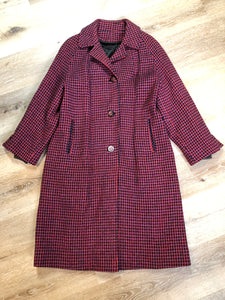 Kingspier Vintage - Mills Brothers red, black and blue houndstooth wool coat. The colours in the houndstooth come together to make a deep purple. This coat features button closures, vertical pockets, knit inner cuffs, a satin lining and zip out genuine chamois inner- lining. Made in Canada. Size medium/ large.