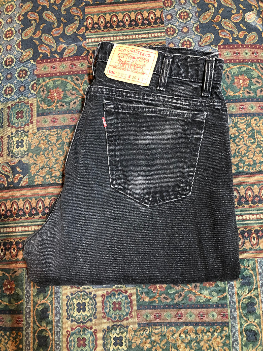 Levi’s 550 - 36”x28” Black Denim Jeans  Vintage Red Tab  High rise  Button fly  Tapered leg  Tagged 36”x30”  100% Cotton  Button stamped “217”  Made in Canada - Kingspier Vintage