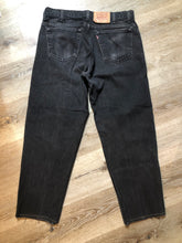 Load image into Gallery viewer, Levi’s 550 - 36”x28” Black Denim Jeans  Vintage Red Tab  High rise  Button fly  Tapered leg  Tagged 36”x30”  100% Cotton  Button stamped “217”  Made in Canada - Kingspier Vintage
