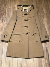 Load image into Gallery viewer, Vintage Gloverall tan duffle coat, with zipper and antler toggle closures, hood and two flap pockets.

80% wool/ 20% polyester
Made in England
Size 40

