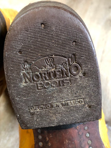 Kingspier Vintage - Norteno tan ostrich leather cowboy boots with decorative stitching, Norteno logo on the sides. Made in the USA.

Size 28.5 Womens

The leather uppers and soles are in good condition with some general wear all over.