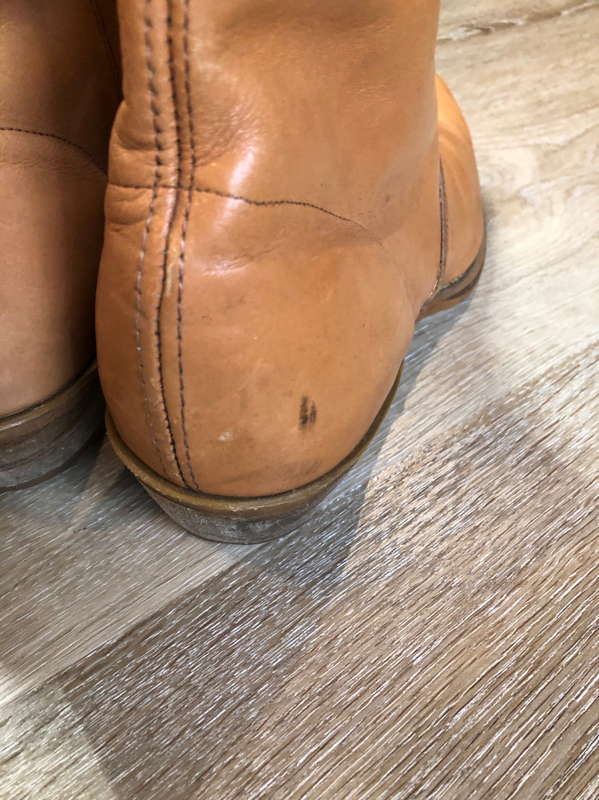 Kingspier Vintage - Light brown leather short cowboy boot with round toe, side zipper and decorative stitching.

Size 11 - 12 Mens

The leather uppers and soles are in excellent condition.