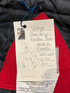 Vintage James Bay 100% pure virgin wool red northern parka with white fur trimmed hood, zipper and snap closures, two zip front pockets, drawstring at the waist, leather trimmed cuffs, a quilted lining and felt applique details.

Made in Canada
Chest 40”