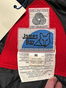 Vintage James Bay 100% pure virgin wool red northern parka with white fur trimmed hood, zipper and snap closures, two zip front pockets, drawstring at the waist, leather trimmed cuffs, a quilted lining and felt applique details.

Made in Canada
Chest 40”