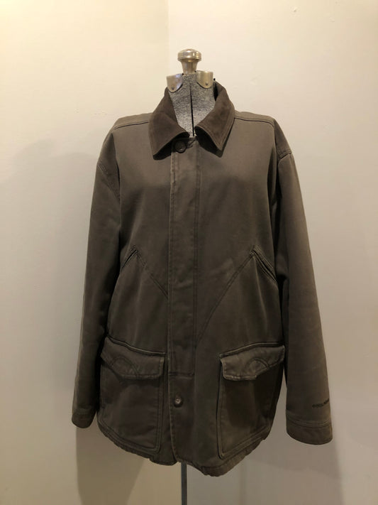 Kingspier Vintage - Woolrich olive green chore jacket features suede collar, flap pockets, hand warmer pockets, zipper and button closures, inside autumn colour striped fleece lining and inside pocket with pencil/ small tool holders. Men’s large.
