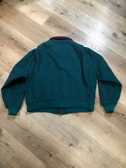 Kingspier Vintage - Vintage Woolrich wool blend bomber style jacket in teal with plaid lining, zipper closure, two front pockets and knit cuffs. The shell is 80% wool/ 20% nylon.

Made in USA
Size Large