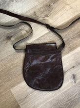 Load image into Gallery viewer, Kingspier Vintage - Asymmetrical brown leather crossbody bag with front magnetic snap closure, one large compartment with small zip pocket inside 

Length - 9.5”
Width - ..5”
Height - 10”
Strap - 49” - 57”

This purse is in excellent condition.
