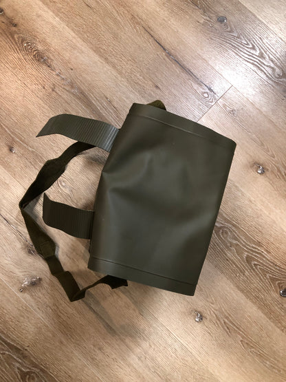 Kingspier Vintage - Deadstock Dutch military issue shoulder bag in dark olive made with waterproof PVC. This bag features a divided main compartment with protective inside flaps that ties in the center and an adjustable canvas shoulder strap.