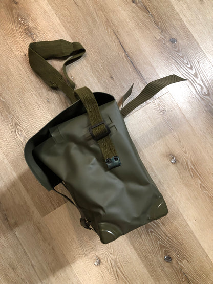 Kingspier Vintage - Deadstock Dutch military issue shoulder bag in dark olive made with waterproof PVC. This bag features a divided main compartment with protective inside flaps that ties in the center and an adjustable canvas shoulder strap.