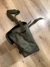 Load image into Gallery viewer, Kingspier Vintage - Deadstock Dutch military issue shoulder bag in dark olive made with waterproof PVC. This bag features a divided main compartment with protective inside flaps that ties in the center and an adjustable canvas shoulder strap.
