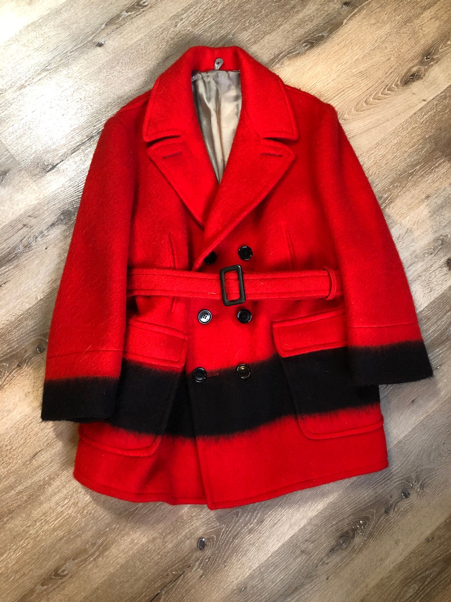 Kingspier Vintage - Genuine Hudson’s Bay Company point blanket coat in red with thick black stripe. The coat features flap pockets and hand warmer pockets, double breasted button closures and belt. Made in Canada. Mens size 48.