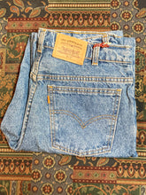 Load image into Gallery viewer, Levi’s 619 - 32”x31.5” Denim Jeans  Vintage Orange Tab  High rise  Straight cut  100% cotton  Medium wash  Button stamped “212”  Labeled 32”x34” with professionally altered hem  Made in Canada - Kingspier Vintage
