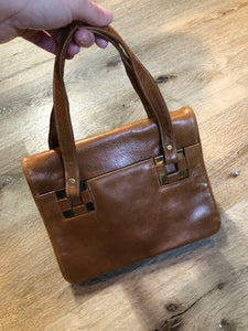 Kingspier Vintage - Jordan Marsh tan leather handbag with gold hardware and three inside compartments. 

