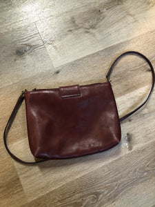 Kingspier Vintage - Etienne Aigner leather crossbody bag with brass hardware, zipper top closure and snap front closure.
