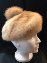 Load image into Gallery viewer, Kingspier Vintage - Vintage Christine Originals Blonde fur hat with fur pom pom. Interior lined in brown floral embroidered nylon mesh. Union made in Montreal, Canada. Size small.

This hat is in excellent condition.
