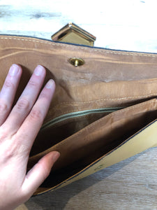 Kingspier Vintage - Tan leather clutch with brass hardware and snap closure. 

