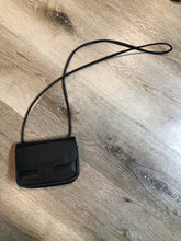 Load image into Gallery viewer, Kingspier Vintage - Small black leather crossbody bag with 
two inside compartments and a small inside mirror.

Length - 6.5”
Width - 2”
Height - 5”
Strap - 45”

This purse is in great condition.
