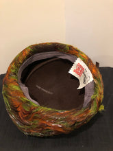 Load image into Gallery viewer, Kingspier Vintage - Lilly Dache Debs brown felt hat with green and orange feathered brim.

Circumference - 21”\

Hat is in excellent vintage condition.
