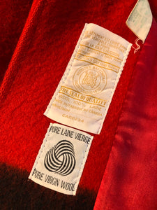 Kingspier Vintage - Hudson’s Bay Company red and black stripe 100% virgin wool point blanket coat in a swing coat style with belt, buckle detail at the collar, button closures, slash pockets and red lining. Size medium/ large.
