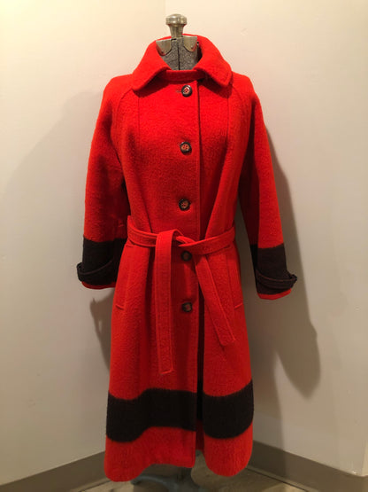 Kingspier Vintage - Hudson’s Bay Company red and black stripe 100% virgin wool point blanket coat in a swing coat style with belt, buckle detail at the collar, button closures, slash pockets and red lining. Size medium/ large.
