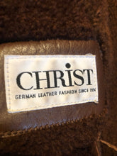 Load image into Gallery viewer, Kingspier Vintage - Vintage “Christ German Leather Fashion” full length buttery soft shearling coat with button closures, two front pockets and removable shoulder pads.

Size 40/ medium/ large
