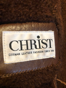 Kingspier Vintage - Vintage “Christ German Leather Fashion” full length buttery soft shearling coat with button closures, two front pockets and removable shoulder pads.

Size 40/ medium/ large