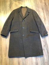 Load image into Gallery viewer, Kingspier Vintage - Vintage grey wool overcoat with button closures, two front pockets and a satin lining.

There are no labels inside this coat.
