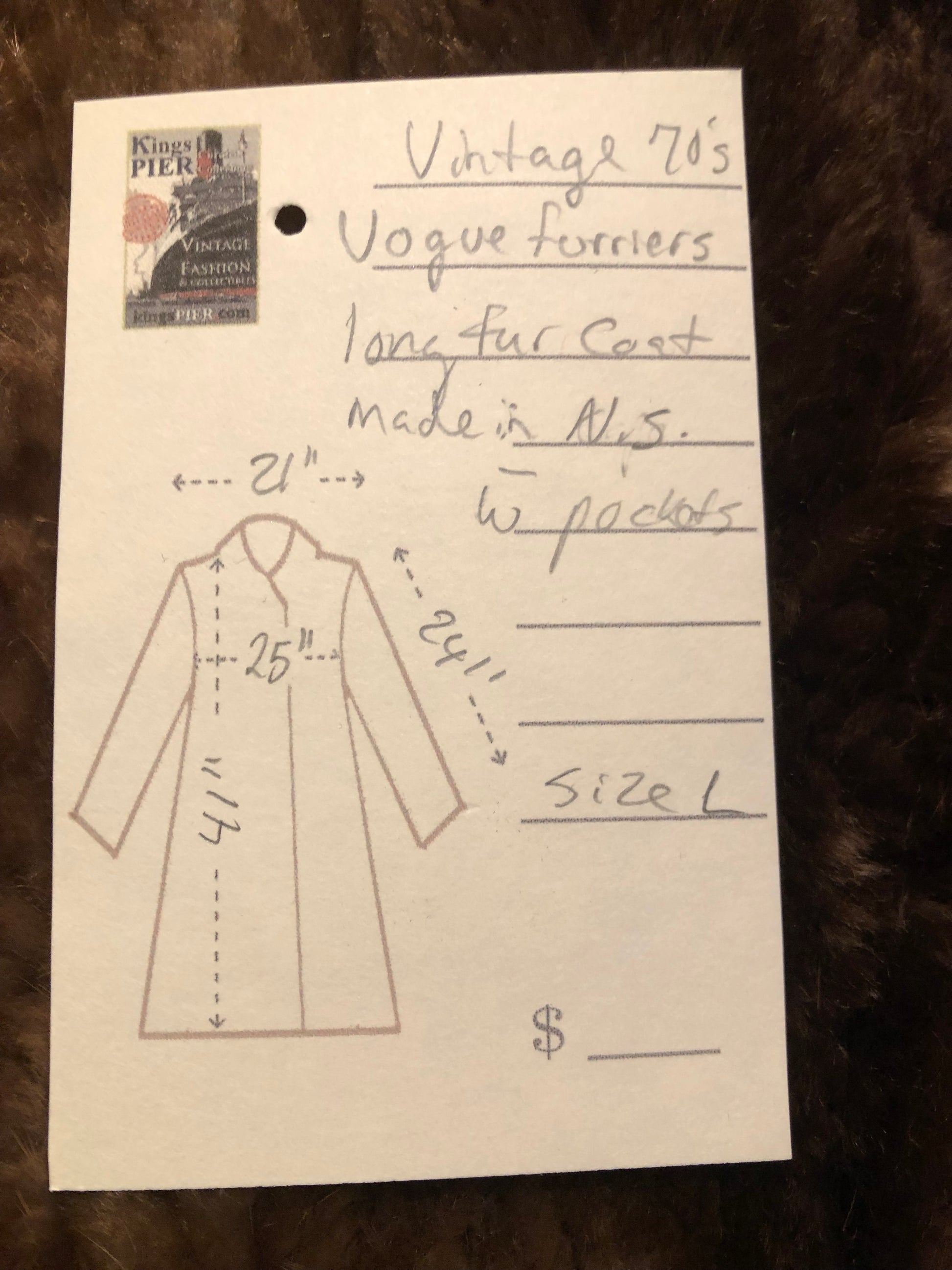 Kingspier Vintage - Vintage Vogue Furriers long fur coat circa 1970’s features leather button closures, two front pockets abd a brown satin lining.

Made in Nova Scotia, Canada.
Size Large.