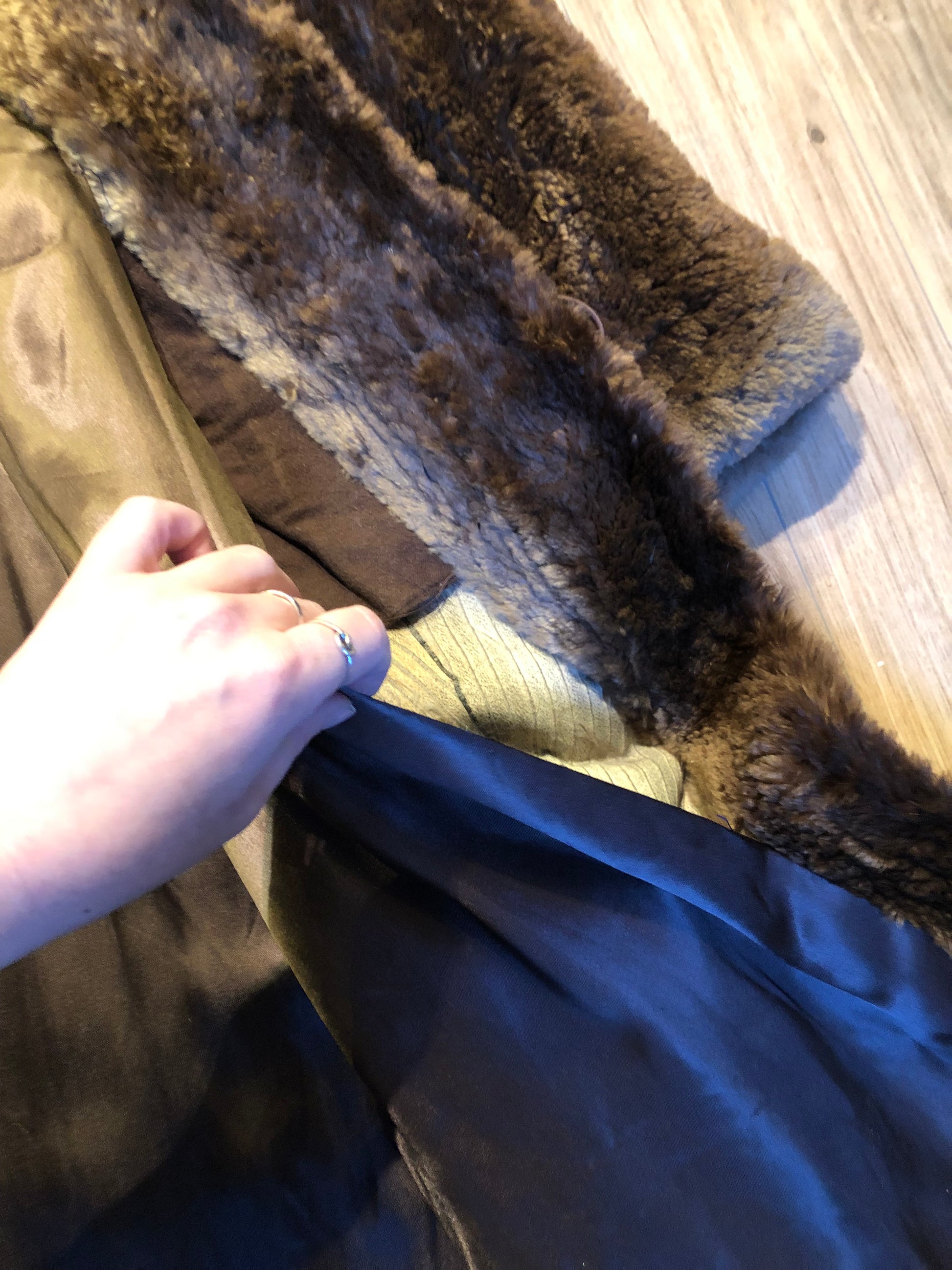 Kingspier Vintage - Vintage Vogue Furriers long fur coat circa 1970’s features leather button closures, two front pockets abd a brown satin lining.

Made in Nova Scotia, Canada.
Size Large.